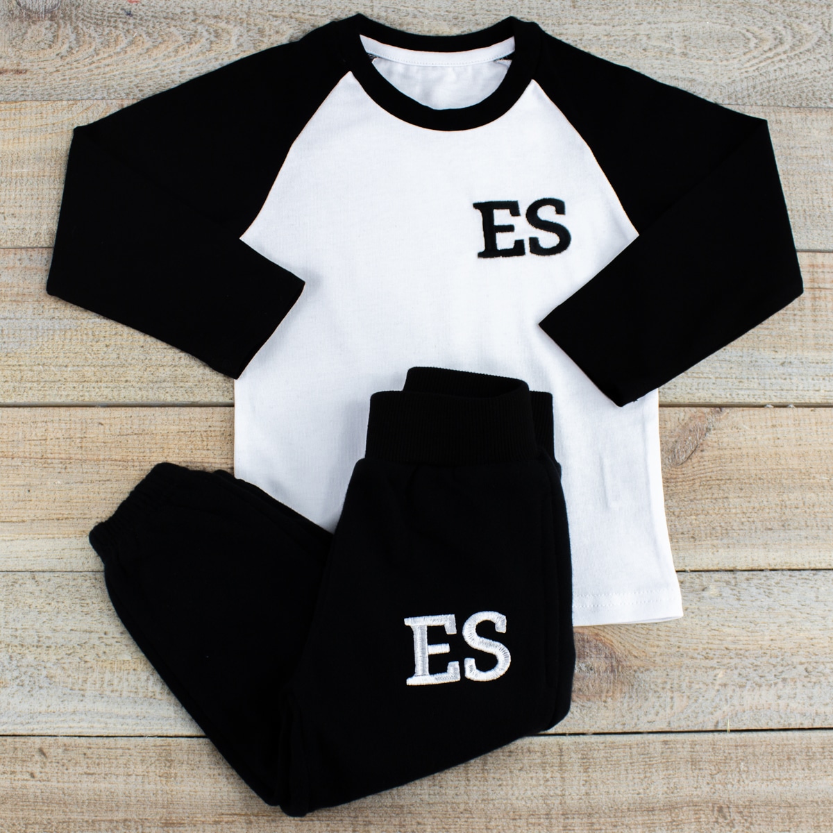 ‘Personalised Black & White Baby/Toddler Loungesuit’